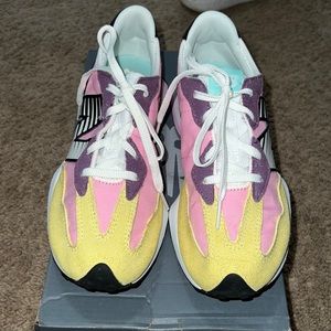 Kids pink and yellow new balance size 4.5